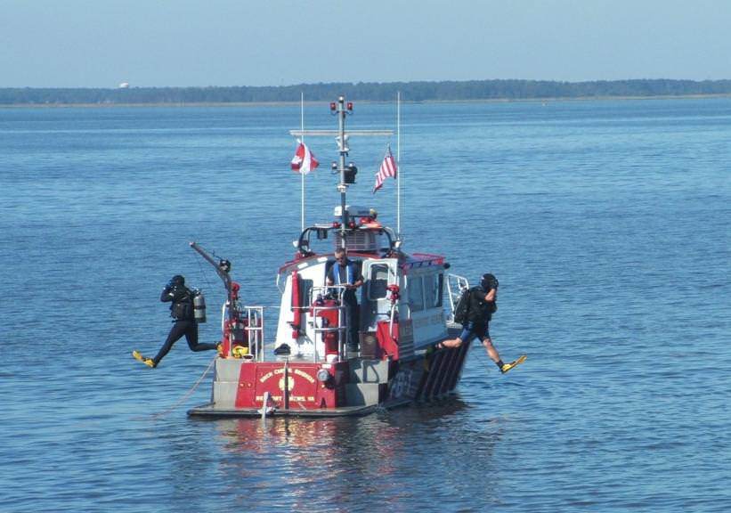 Newport News' newest fireboat, a MetalCraft Marine FireStorm 32, shown here supporting dive operations in Hampton Roads, Virginia.